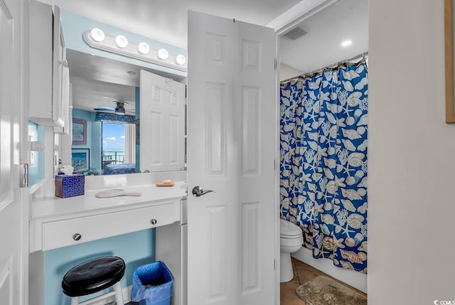1690 N Waccamaw Dr Unit 103, Garden City Beach, SC 29576 - bathroom featuring toilet, tile patterned floors, wallpapered walls, and curtained shower