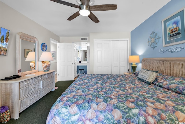 1690 N Waccamaw Dr Unit 103, Garden City Beach, SC 29576 - bedroom with dark colored carpet, a closet, and a ceiling fan