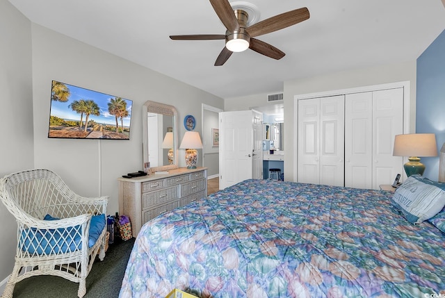 1690 N Waccamaw Dr Unit 103, Garden City Beach, SC 29576 - bedroom with a closet, a ceiling fan, and baseboards