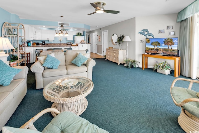 1690 N Waccamaw Dr Unit 103, Garden City Beach, SC 29576 - living area with carpet and ceiling fan