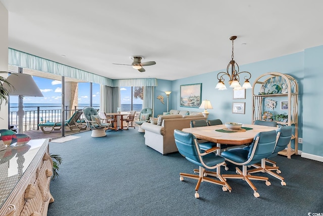 1690 N Waccamaw Dr Unit 103, Garden City Beach, SC 29576 - dining space featuring carpet floors, a water view, ceiling fan, and a chandelier