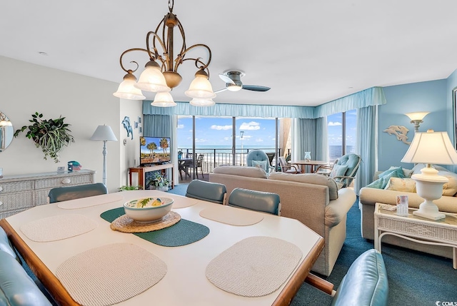 1690 N Waccamaw Dr Unit 103, Garden City Beach, SC 29576 - dining room with healthy amount of natural light, a ceiling fan, and carpet floors