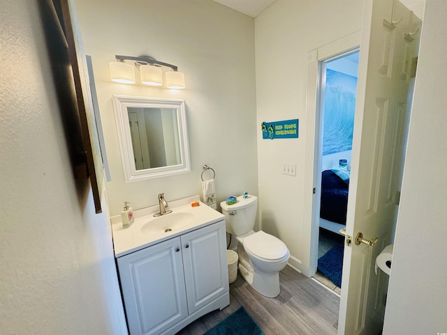 4783 Wild Iris Dr Unit 101, Myrtle Beach, SC 29577 - bathroom with toilet, wood finished floors, vanity, and ensuite bath