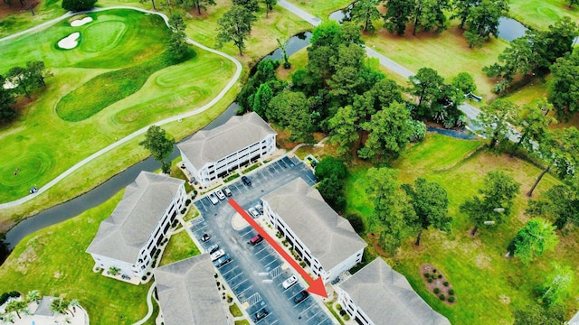 4783 Wild Iris Dr Unit 101, Myrtle Beach, SC 29577 - drone / aerial view of a golf course and a large body of water