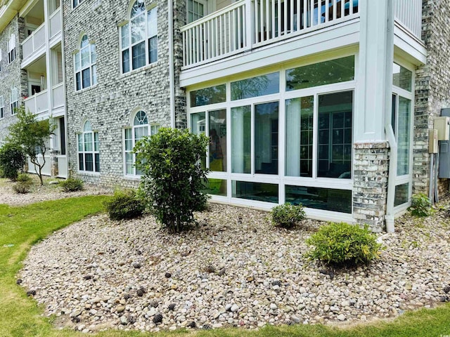 4783 Wild Iris Dr Unit 101, Myrtle Beach, SC 29577 - view of side of property featuring stone siding
