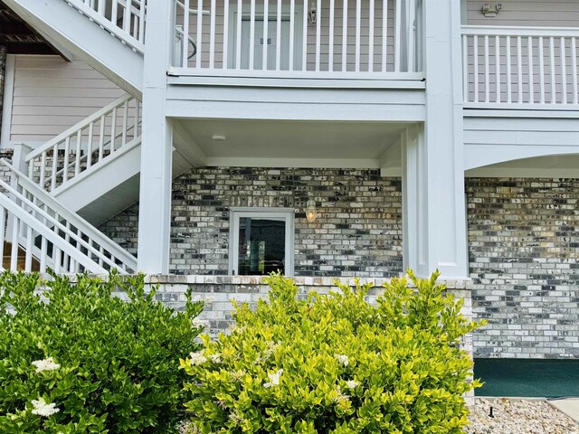 4783 Wild Iris Dr Unit 101, Myrtle Beach, SC 29577 - view of exterior entry featuring brick siding