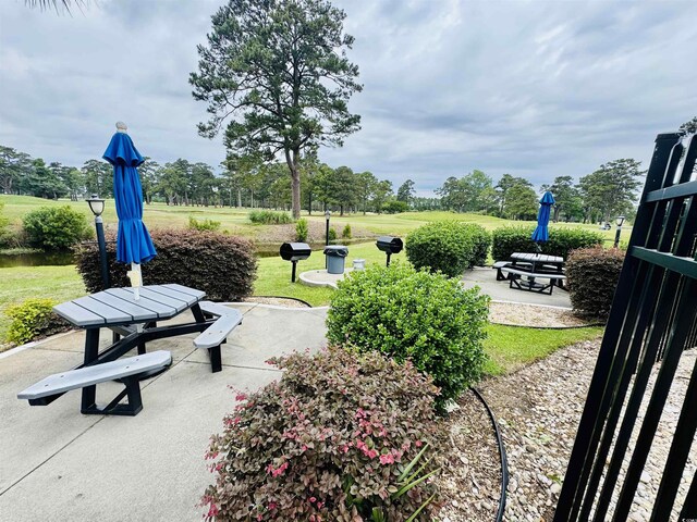 4783 Wild Iris Dr Unit 101, Myrtle Beach, SC 29577 - view of community featuring a patio and a lawn