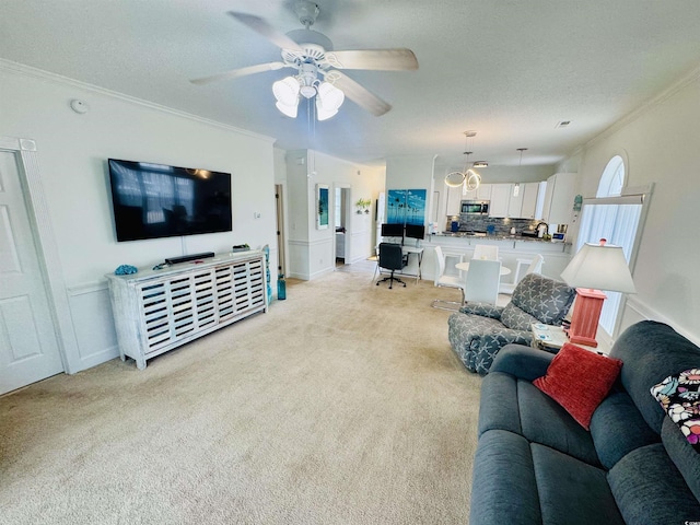 4783 Wild Iris Dr Unit 101, Myrtle Beach, SC 29577 - living area featuring crown molding, light colored carpet, a textured ceiling, and a ceiling fan