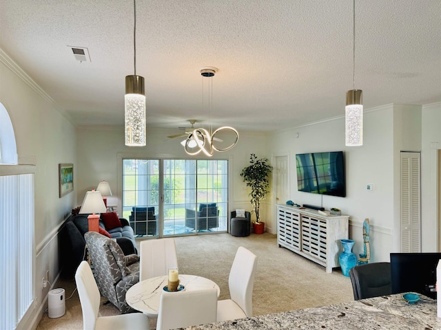 4783 Wild Iris Dr Unit 101, Myrtle Beach, SC 29577 - carpeted living area featuring a textured ceiling, ornamental molding, and a chandelier