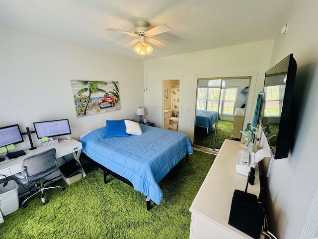 4783 Wild Iris Dr Unit 101, Myrtle Beach, SC 29577 - bedroom featuring carpet, an office area, a closet, a textured ceiling, and ceiling fan