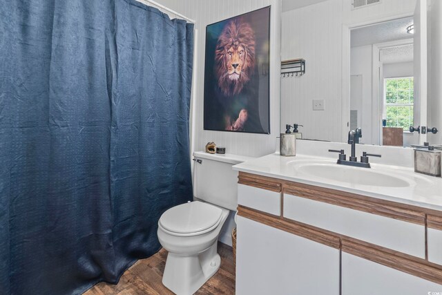 8862 Duckview Dr Unit E, Surfside Beach, SC 29575 - full bath featuring toilet, wood finished floors, vanity, and a shower with shower curtain