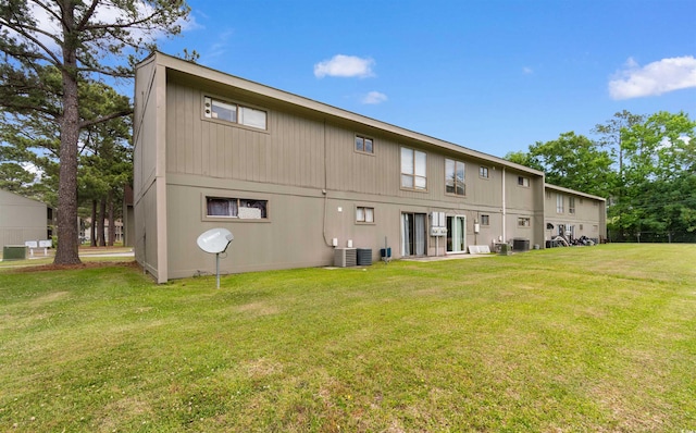 2000 Greens Blvd Unit 40C, Myrtle Beach, SC 29577 - rear view of house with a lawn and central AC unit