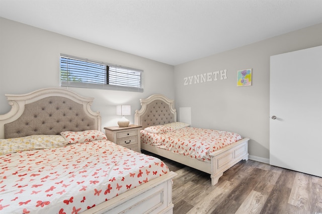 2000 Greens Blvd Unit 40C, Myrtle Beach, SC 29577 - bedroom with wood finished floors and baseboards