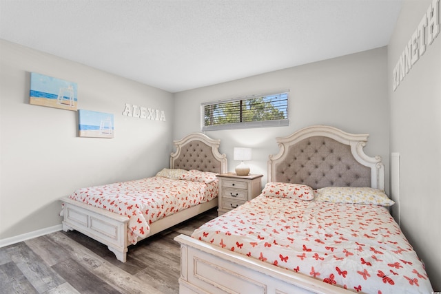 2000 Greens Blvd Unit 40C, Myrtle Beach, SC 29577 - bedroom featuring wood finished floors and baseboards