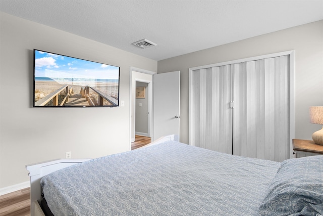 2000 Greens Blvd Unit 40C, Myrtle Beach, SC 29577 - bedroom with wood finished floors and baseboards