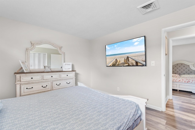 2000 Greens Blvd Unit 40C, Myrtle Beach, SC 29577 - bedroom featuring light wood-type flooring and baseboards