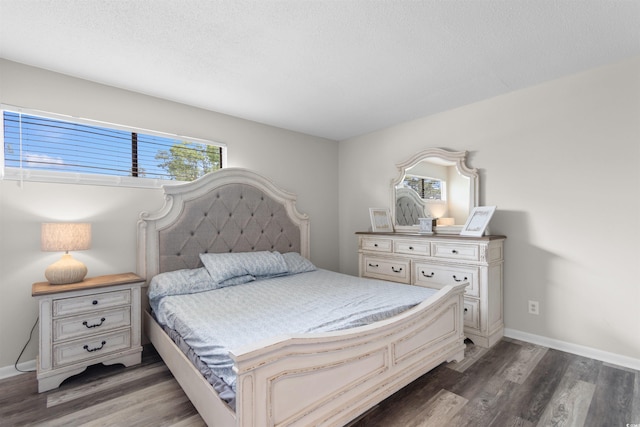 2000 Greens Blvd Unit 40C, Myrtle Beach, SC 29577 - bedroom with wood finished floors, baseboards, and a textured ceiling