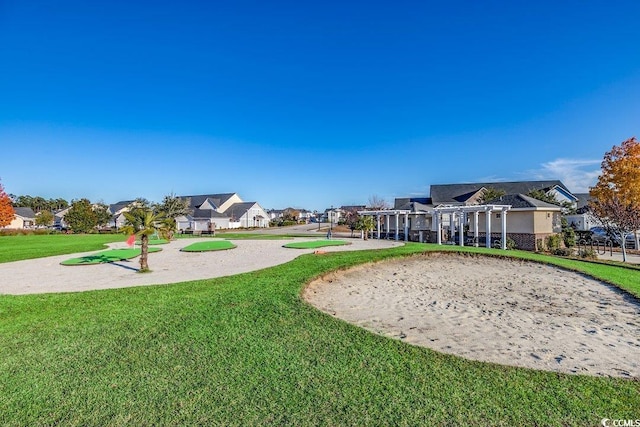 view of home's community with a yard and a residential view