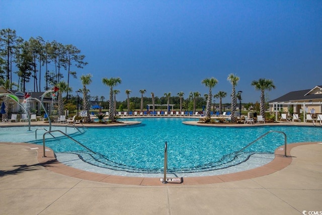 community pool featuring a patio area