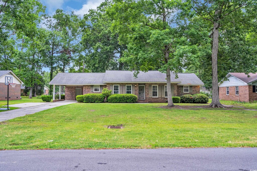 1108 Chicora Blvd, Conway, SC 29526 - single story home with concrete driveway, a carport, and a front yard