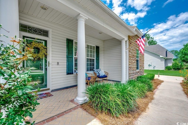100 Woodlyn Ave, Little River, SC 29566 - property entrance with a porch and stone siding