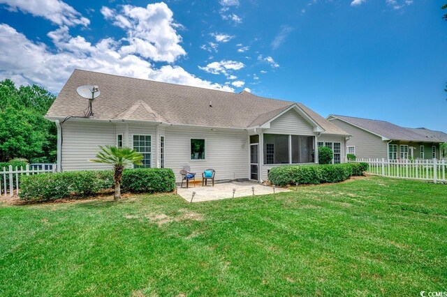 100 Woodlyn Ave, Little River, SC 29566 - rear view of property featuring a patio area and a sunroom