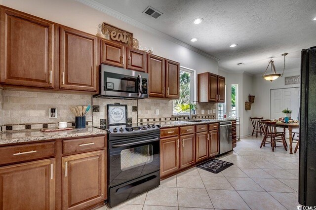 100 Woodlyn Ave, Little River, SC 29566 - kitchen featuring black appliances, ornamental molding, a sink, tasteful backsplash, and light tile patterned floors
