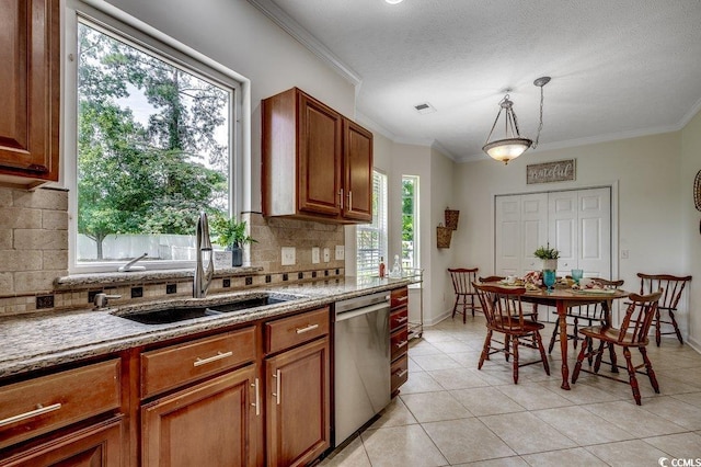 100 Woodlyn Ave, Little River, SC 29566 - kitchen with stainless steel dishwasher, a sink, backsplash, light tile patterned floors, and crown molding