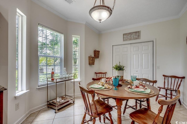 100 Woodlyn Ave, Little River, SC 29566 - dining room featuring light tile patterned flooring, crown molding, and baseboards