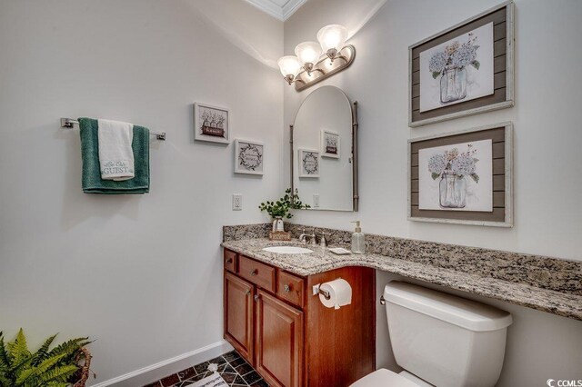 100 Woodlyn Ave, Little River, SC 29566 - half bathroom with baseboards, vanity, toilet, crown molding, and a chandelier