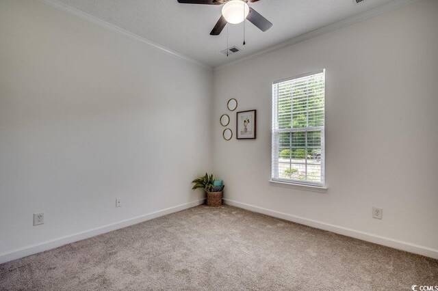 100 Woodlyn Ave, Little River, SC 29566 - carpeted spare room featuring baseboards, ornamental molding, and a ceiling fan