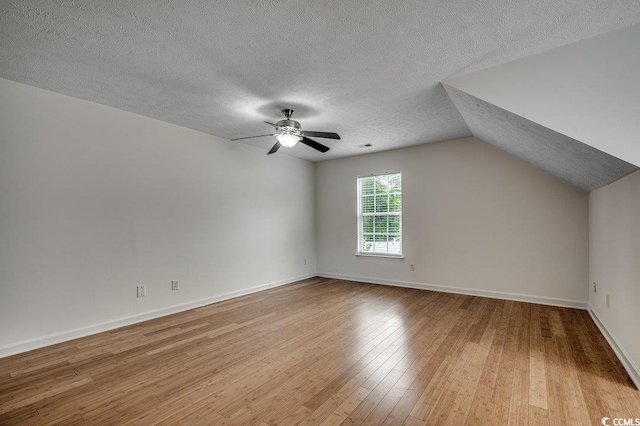 100 Woodlyn Ave, Little River, SC 29566 - additional living space with ceiling fan, a textured ceiling, wood finished floors, and baseboards