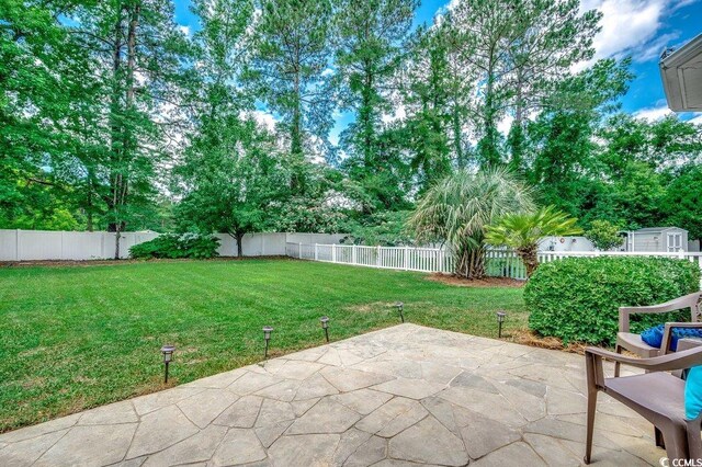100 Woodlyn Ave, Little River, SC 29566 - view of yard featuring a patio