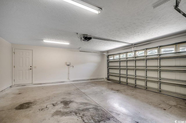 100 Woodlyn Ave, Little River, SC 29566 - garage with a garage door opener and baseboards