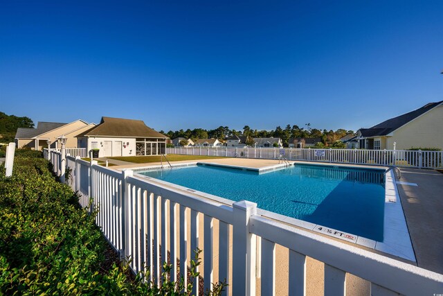 100 Woodlyn Ave, Little River, SC 29566 - community pool with a residential view
