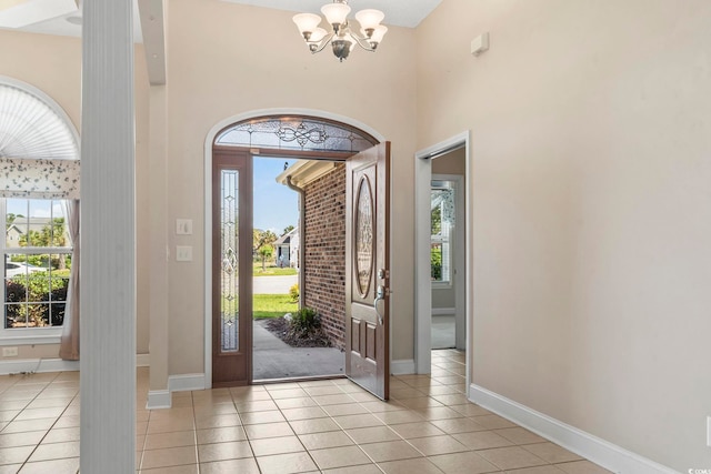 8204 Caddis Ct, Myrtle Beach, SC 29579 - foyer featuring light tile patterned flooring, a chandelier, and a high ceiling