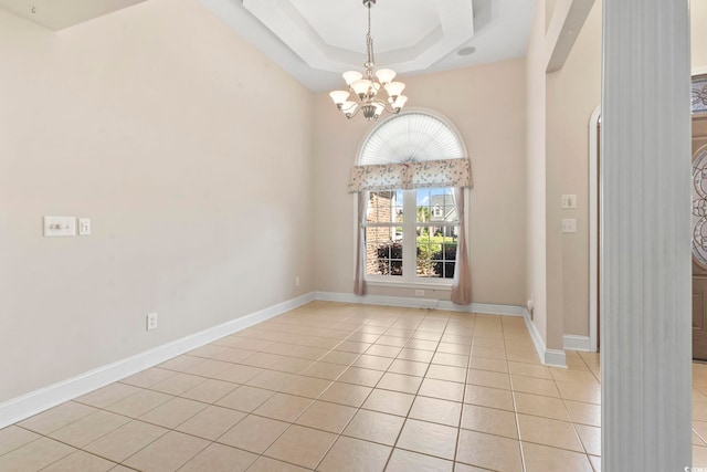 8204 Caddis Ct, Myrtle Beach, SC 29579 - unfurnished room featuring a chandelier, light tile patterned floors, and a tray ceiling