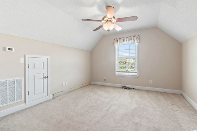 8204 Caddis Ct, Myrtle Beach, SC 29579 - bonus room with ceiling fan, lofted ceiling, carpet flooring, and a textured ceiling