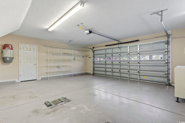 8204 Caddis Ct, Myrtle Beach, SC 29579 - garage with a central vacuum unit and a garage door opener
