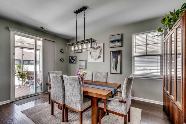 5406 Longhorn Dr, Myrtle Beach, SC 29588 - dining area with healthy amount of natural light, baseboards, and dark wood finished floors