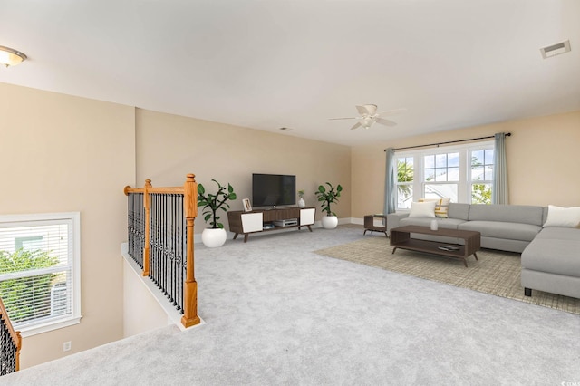 living room with carpet floors and ceiling fan