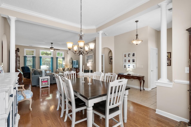 190 Barony Pl, Pawleys Island, SC 29585 - dining area with decorative columns, ceiling fan, wood finished floors, arched walkways, and crown molding