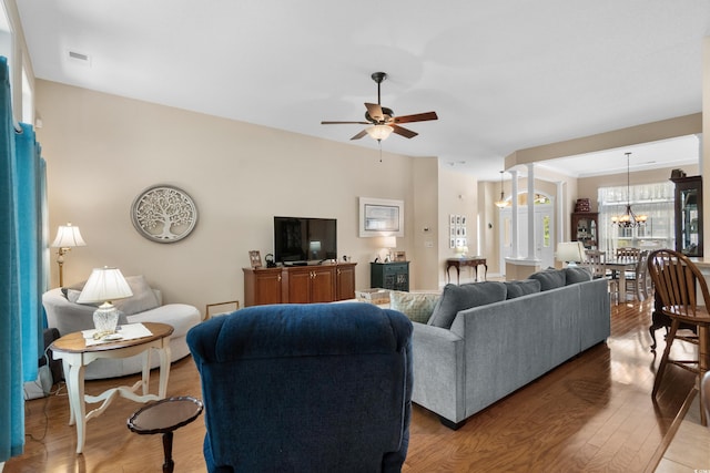 190 Barony Pl, Pawleys Island, SC 29585 - living area with ceiling fan, light wood finished floors, and a chandelier