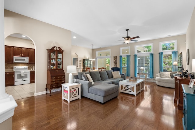 190 Barony Pl, Pawleys Island, SC 29585 - living area featuring a ceiling fan, arched walkways, wood finished floors, and a chandelier