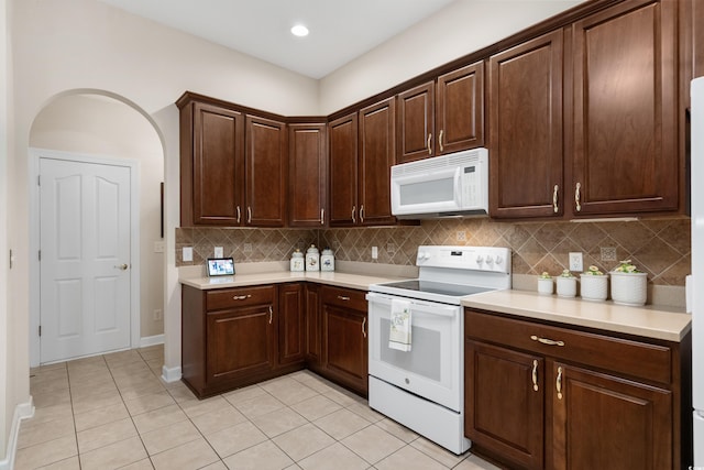 190 Barony Pl, Pawleys Island, SC 29585 - kitchen featuring white appliances, light countertops, light tile patterned flooring, and tasteful backsplash
