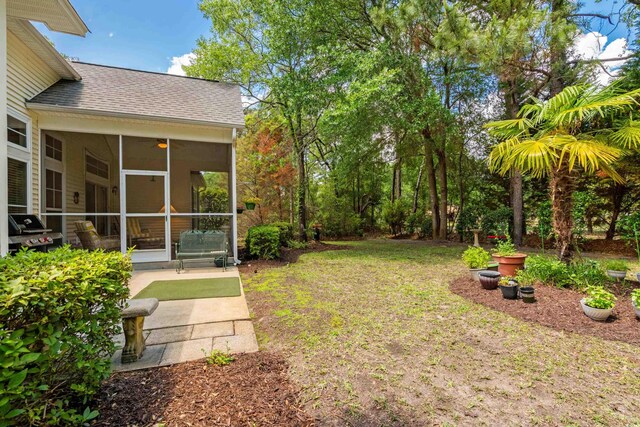 190 Barony Pl, Pawleys Island, SC 29585 - view of green lawn featuring a sunroom