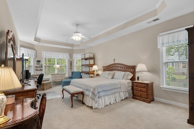 190 Barony Pl, Pawleys Island, SC 29585 - bedroom featuring a raised ceiling, light carpet, multiple windows, baseboards, and crown molding