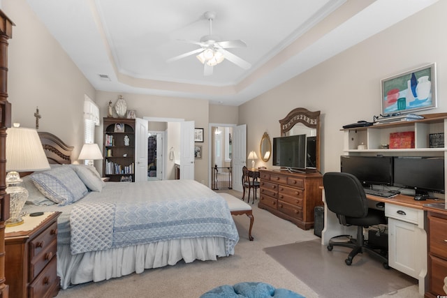 190 Barony Pl, Pawleys Island, SC 29585 - bedroom with a desk, light colored carpet, ornamental molding, a raised ceiling, and ceiling fan