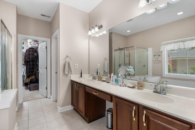 190 Barony Pl, Pawleys Island, SC 29585 - full bath featuring a stall shower, tile patterned flooring, double vanity, a spacious closet, and baseboards