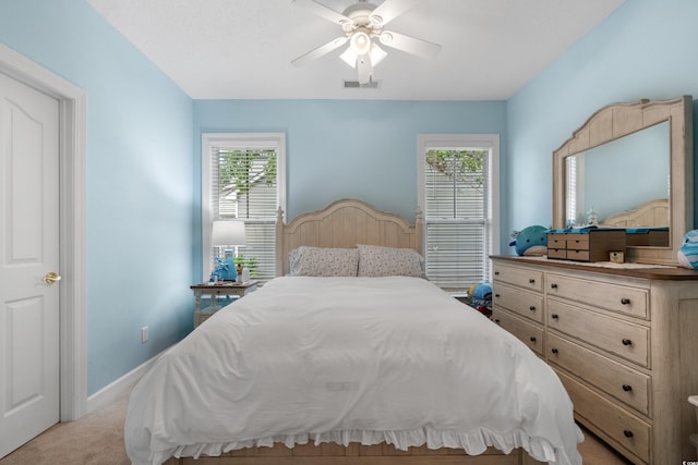 190 Barony Pl, Pawleys Island, SC 29585 - bedroom with light colored carpet, a ceiling fan, and baseboards